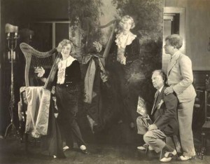 25:4  Christy paints actress Marion Davies, at left, in her costume from the film "Little Old New York."  Painting commissioned by Sid Grauman, right, for the Chinese Theater in Los Angeles, California, 1925.
