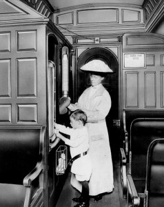 Jessie Moore Ward and son Philip on railroad car at Dixie dispenser, ca. 1912