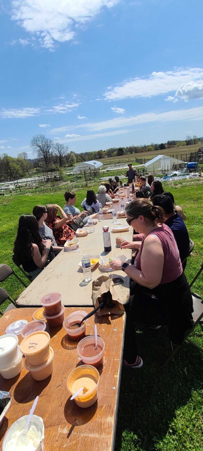 Lafayette Staff enjoying lunch outdoors at LaFarm