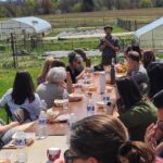 Lafayette Staff enjoying lunch outdoors at LaFarm