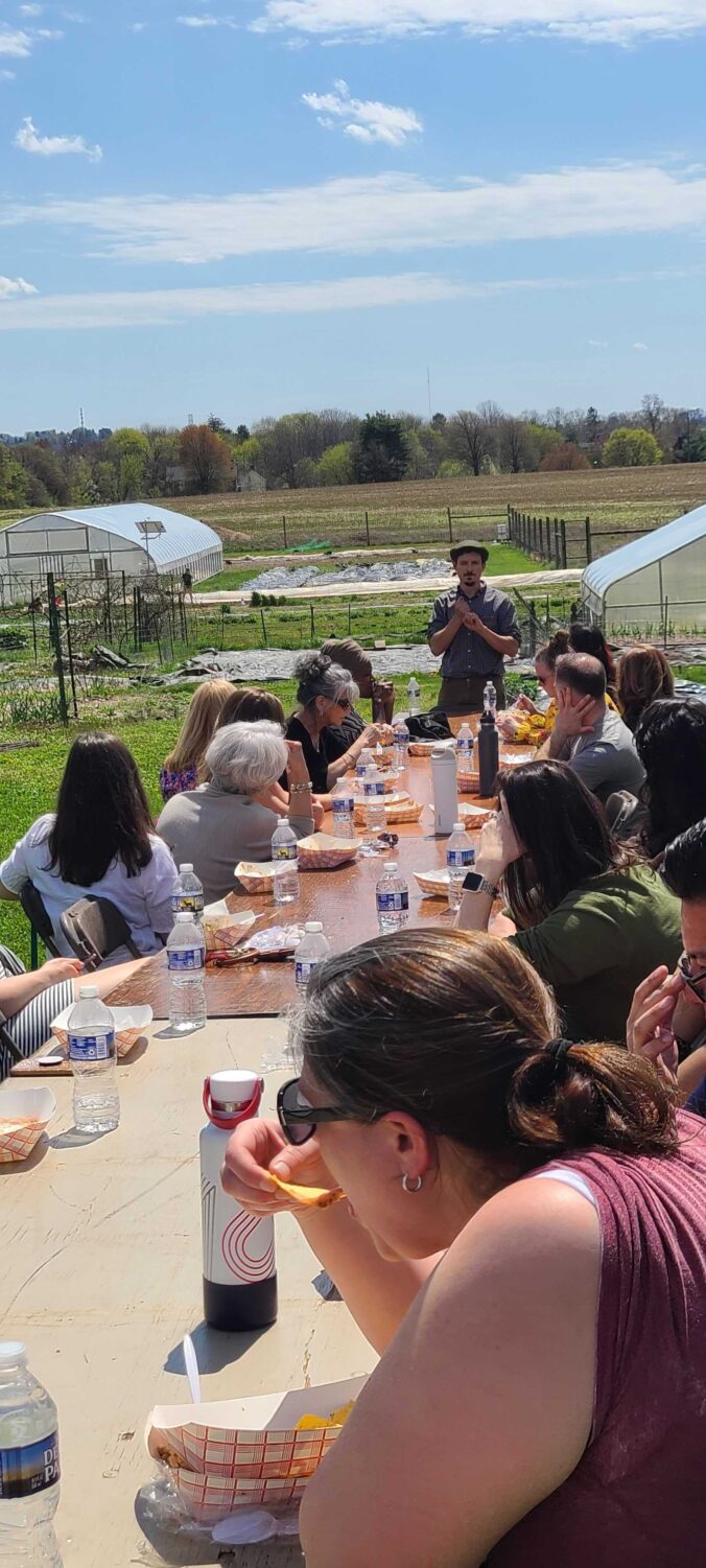 Lafayette Staff enjoying lunch outdoors at LaFarm