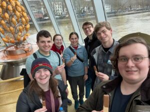 Group photo in front of the Lindt chocolate fountain at the Museum 