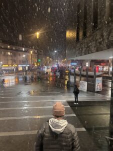 My roomate, Donovan, going down the steps from the restaurant as snow falls down