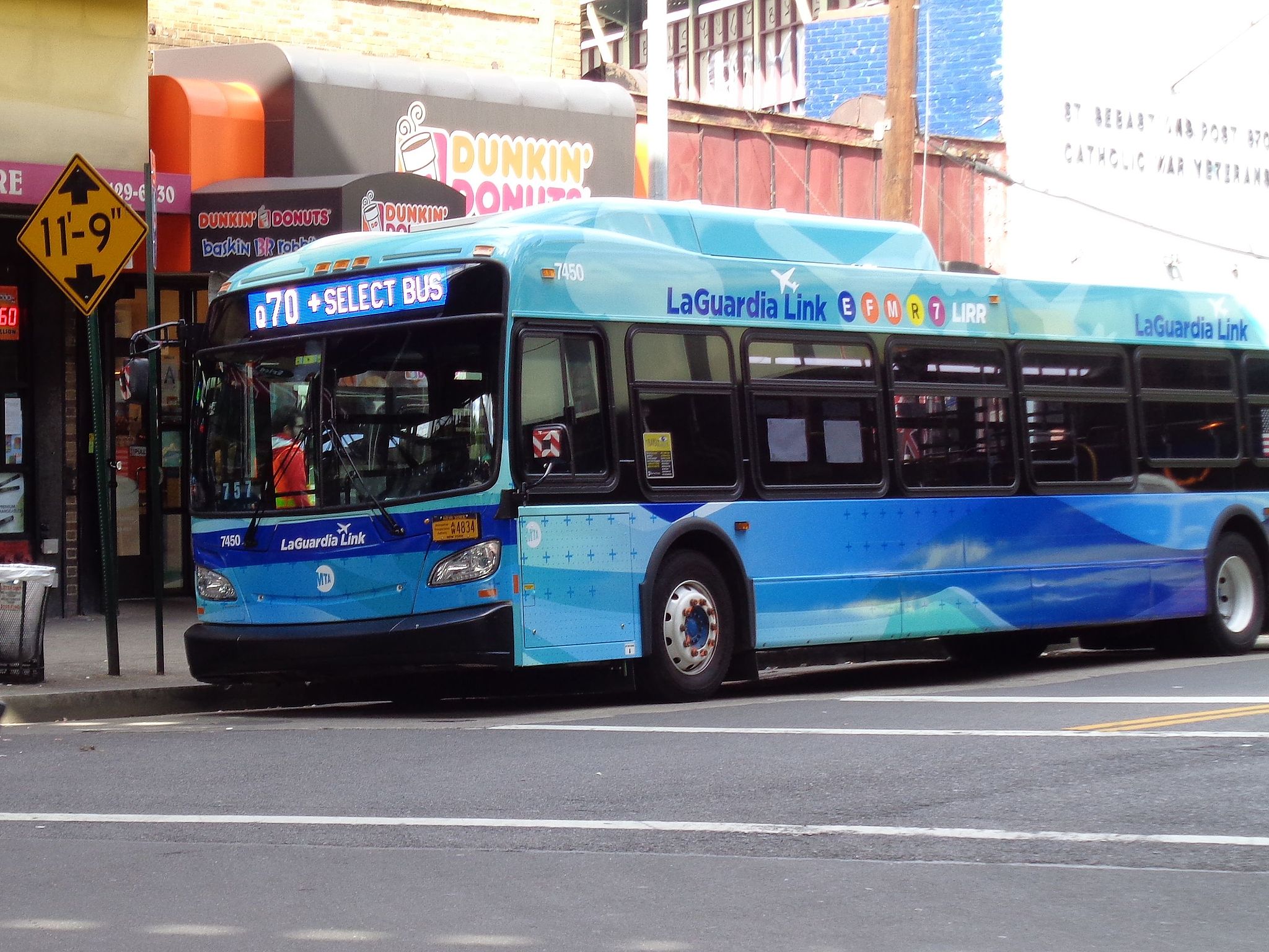 A bus in blue livery on a street