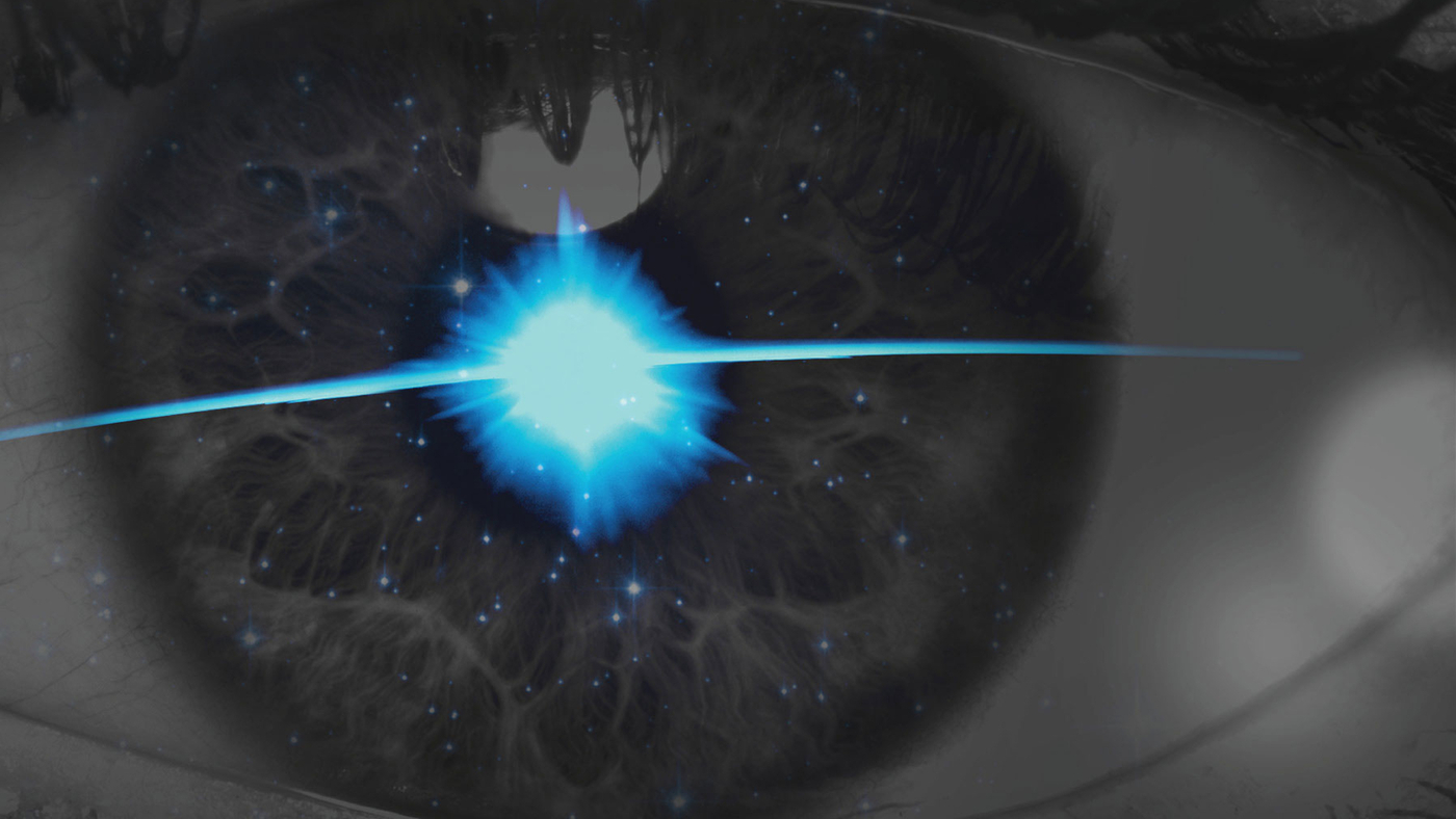 A close up of an eye with a stellar flare in the center