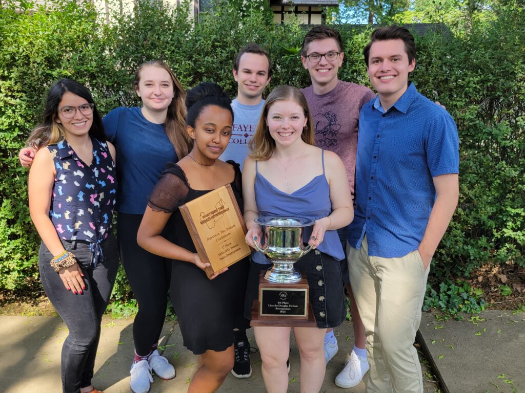 From Left, top: Andrea Rivera Conte, Ceci Montufar, Ben Herman, Jacob Moldover, Joshua Hulon Hale. Bottom, center: Yordanos Mengistu, Luisa Gunn holding the NTDC 1st place team award and the 4th place debate sweepstakes award from NFA Nationals